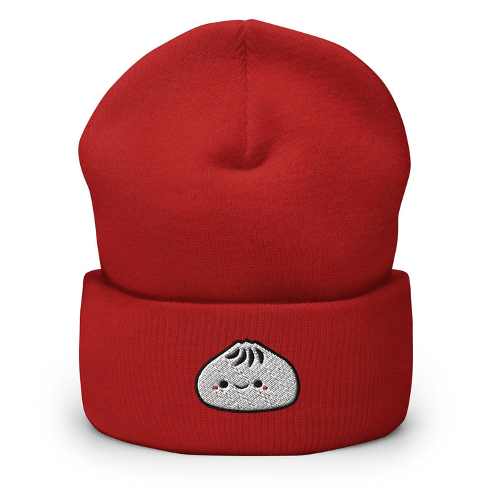 a red beanie with a white face on it
