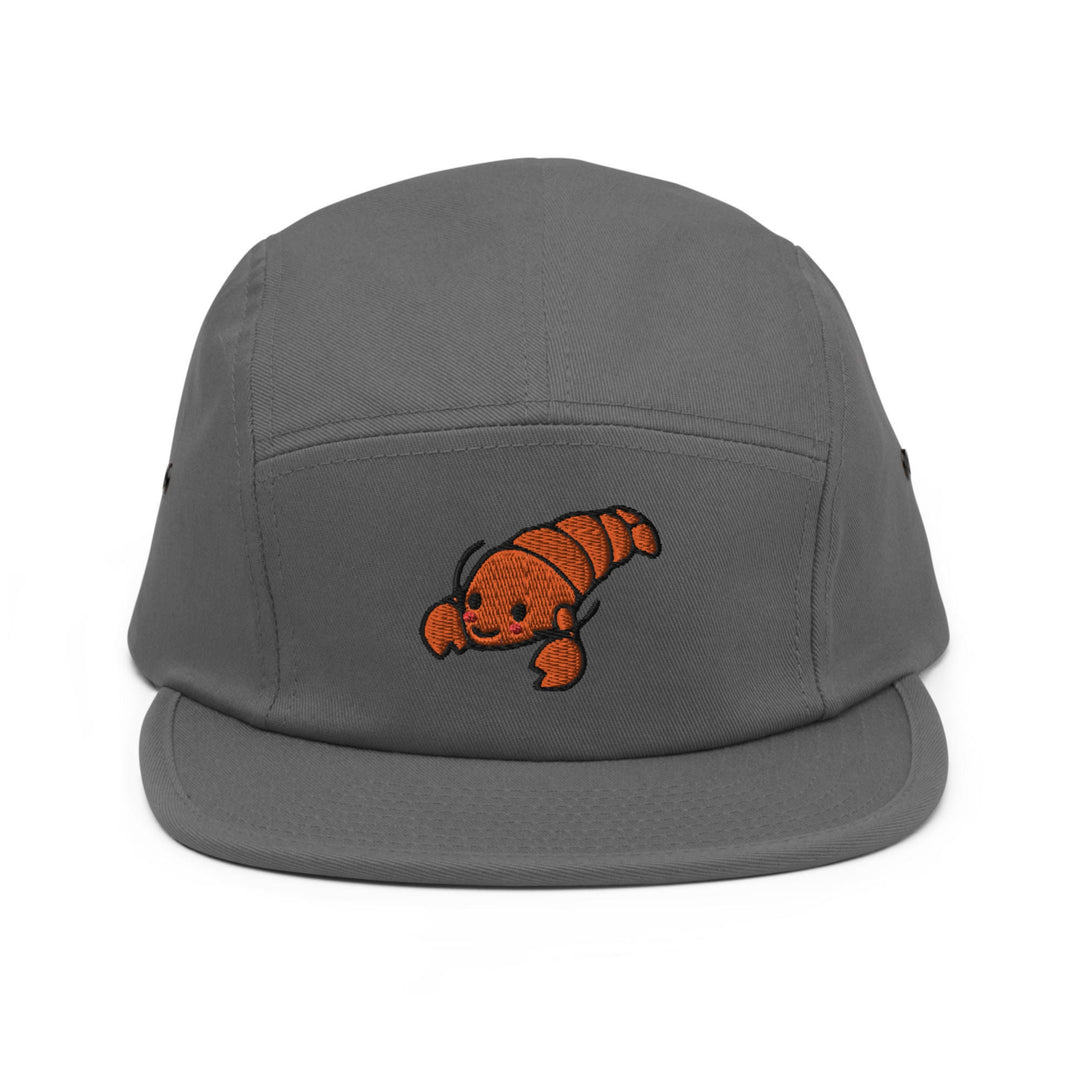 a gray hat with an orange fish embroidered on it