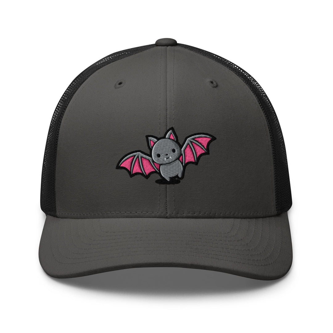 a gray and black trucker hat with a pink bat embroidered on the front