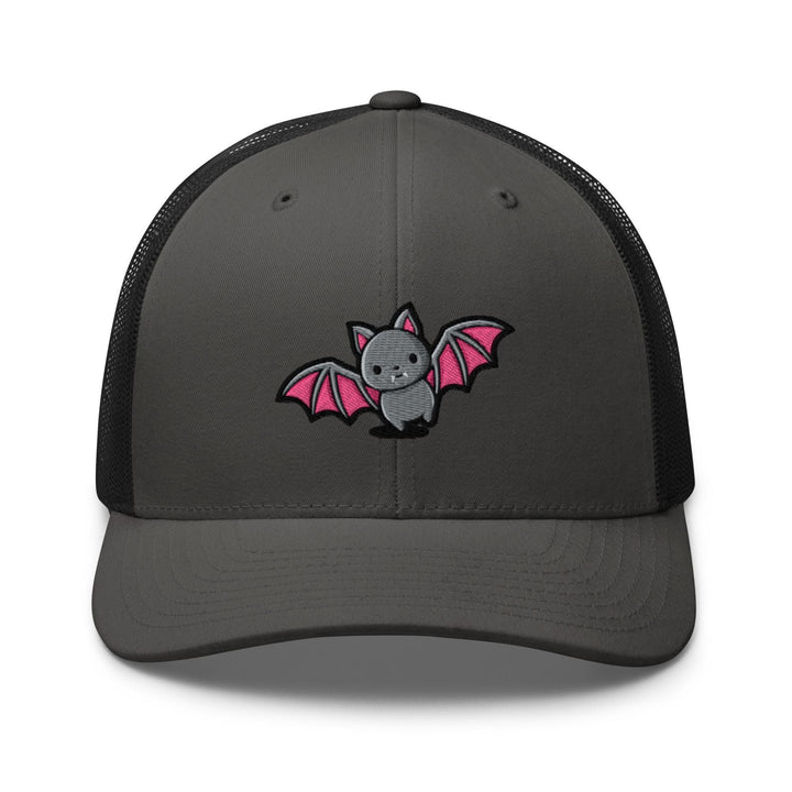 a gray and black trucker hat with a pink bat embroidered on the front