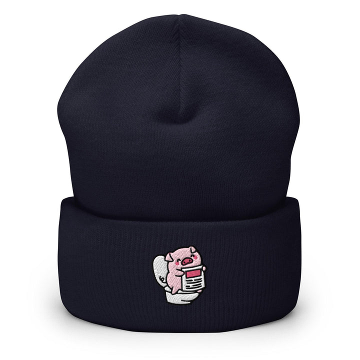 a black beanie with a pink pig on it