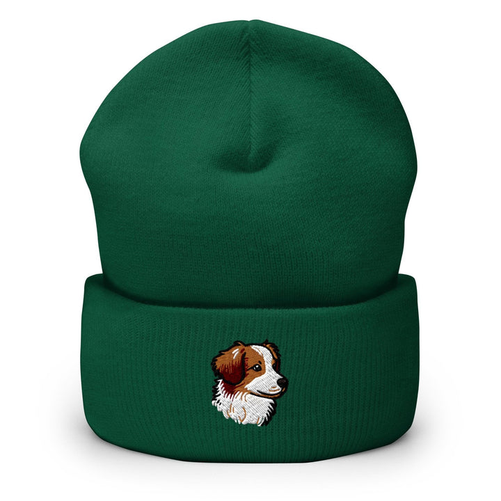 a green beanie with a picture of a dog on it