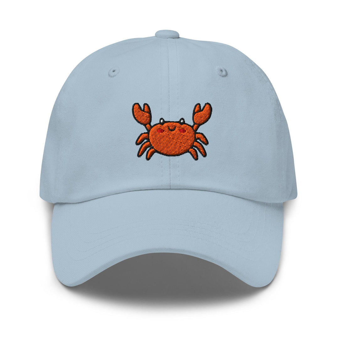 a blue hat with a crab embroidered on it