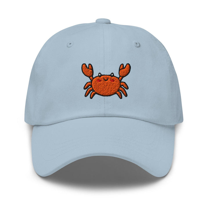 a blue hat with a crab embroidered on it