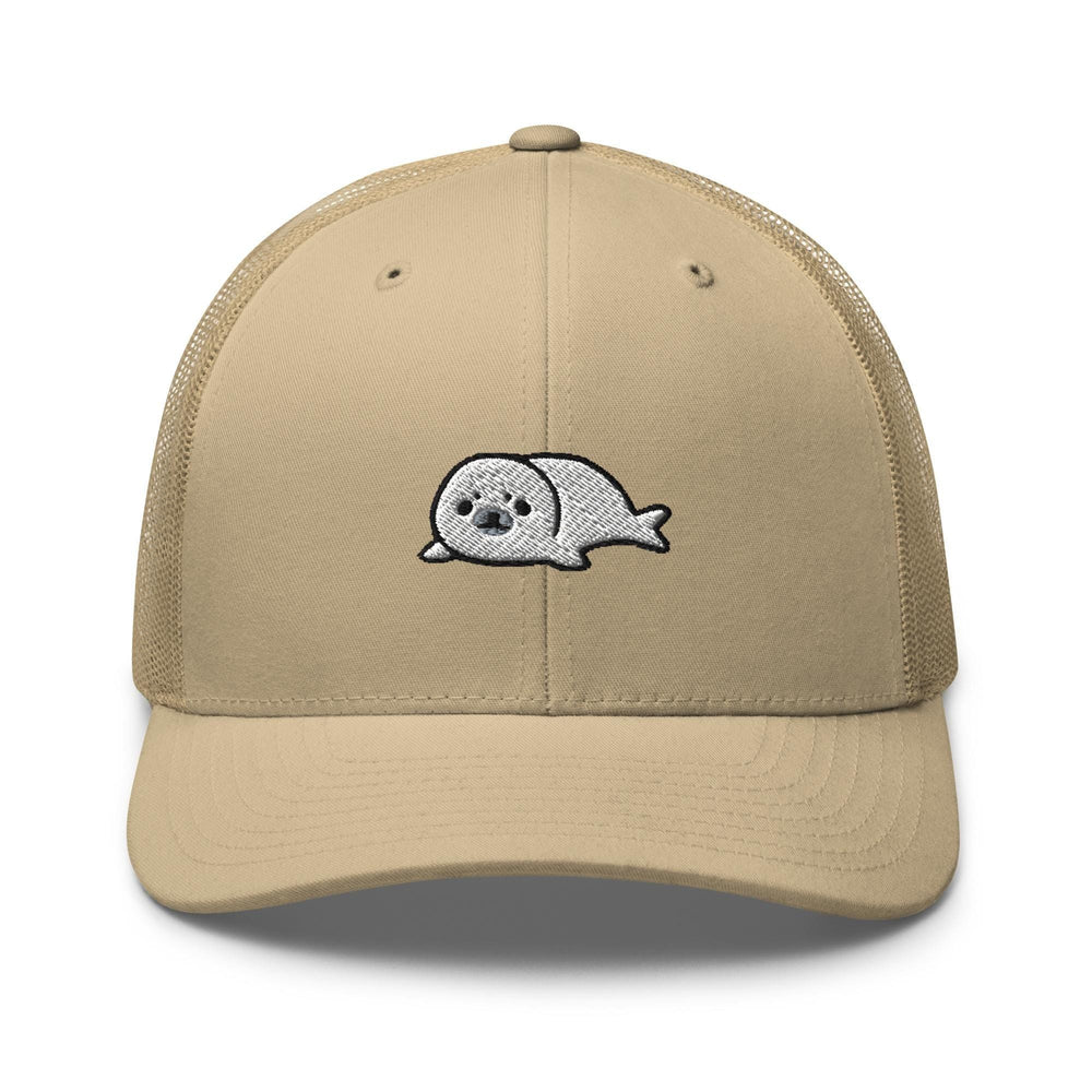 a tan trucker hat with a white whale embroidered on the front