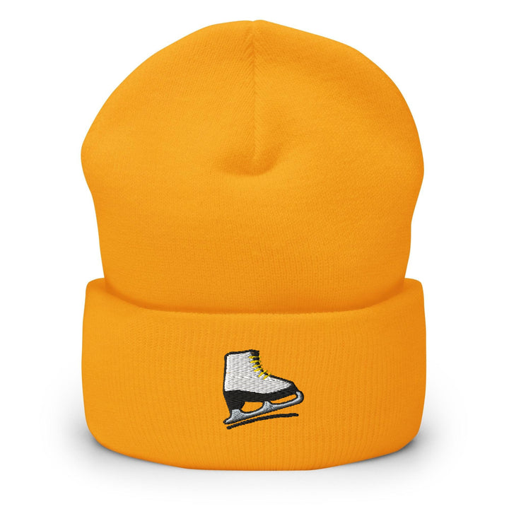 a yellow hat with a pair of ice skates on it