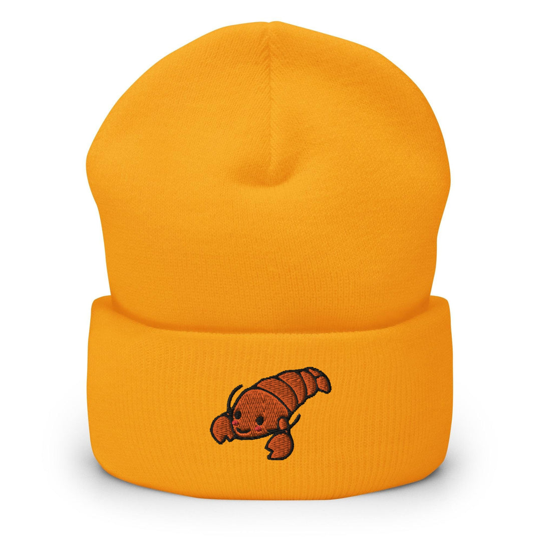 a yellow beanie with a red dog on it