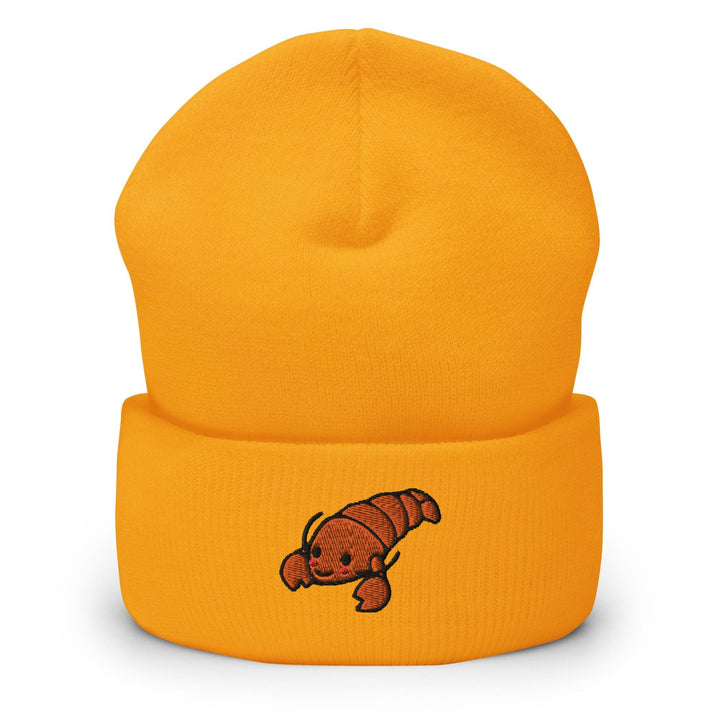 a yellow beanie with a red dog on it