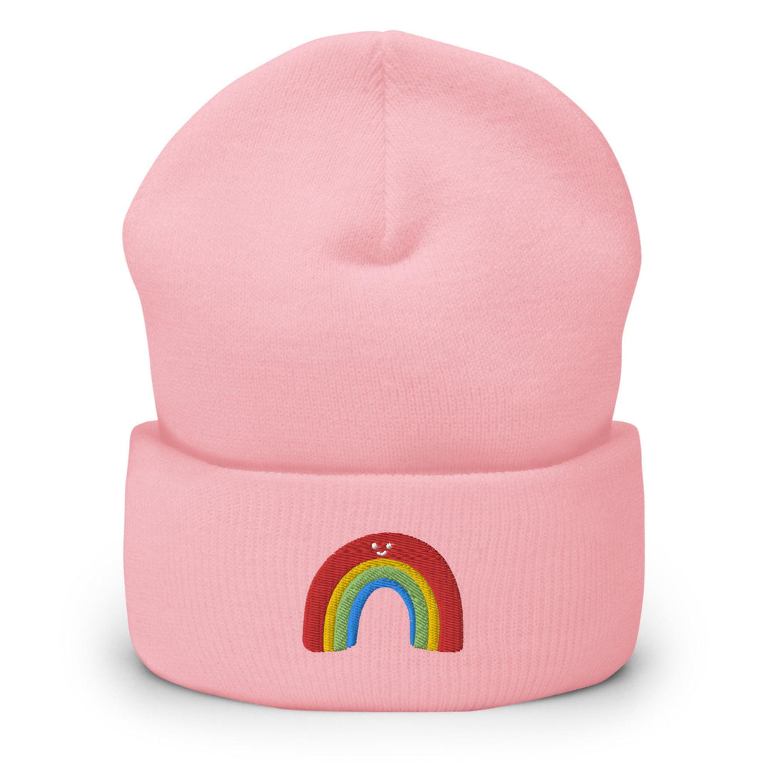 a pink beanie with a rainbow on it