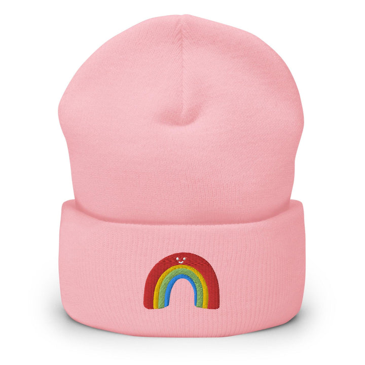 a pink beanie with a rainbow on it