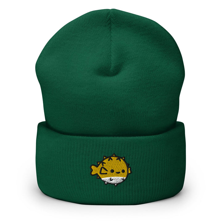a green beanie with a yellow lion on it
