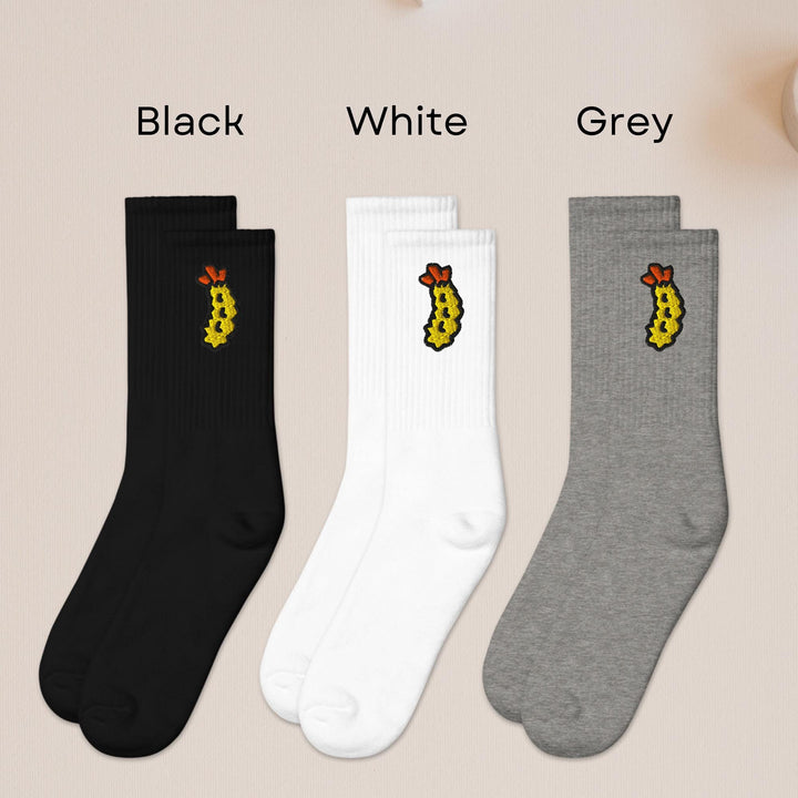 three pairs of black, white, and grey socks