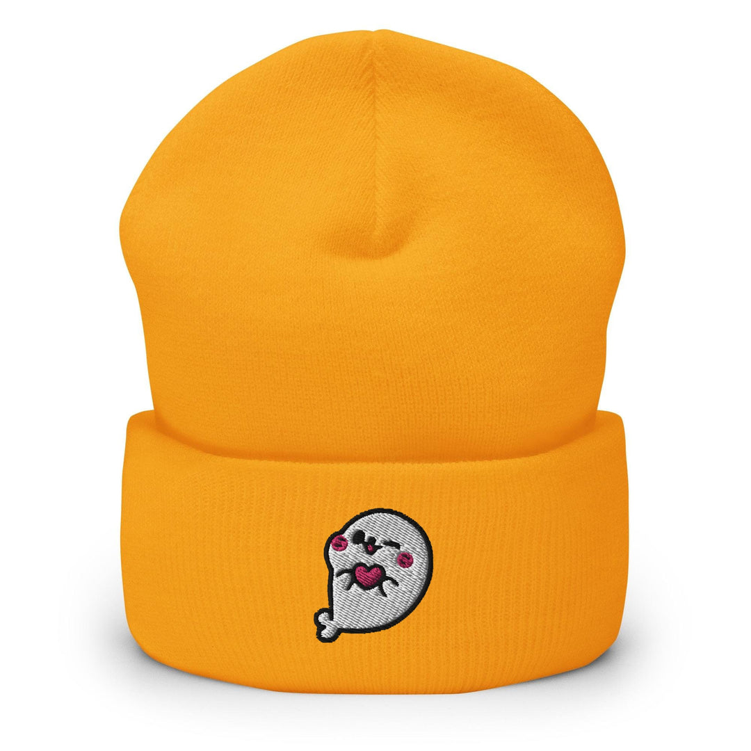 a yellow beanie with a cartoon character on it