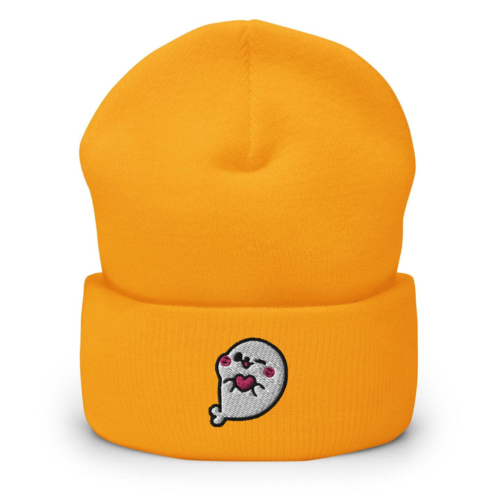 a yellow beanie with a cartoon character on it