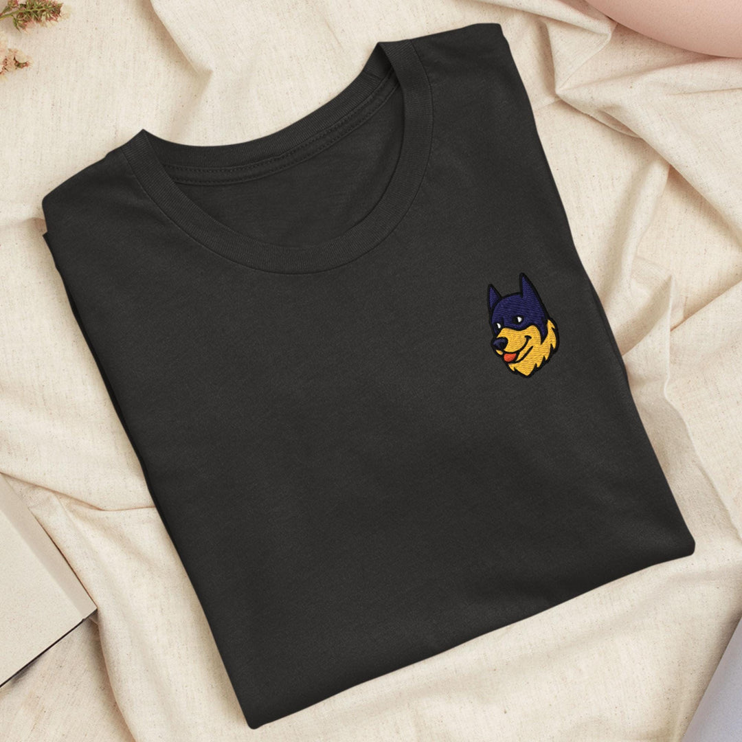 a black t - shirt with a batman embroidered on it