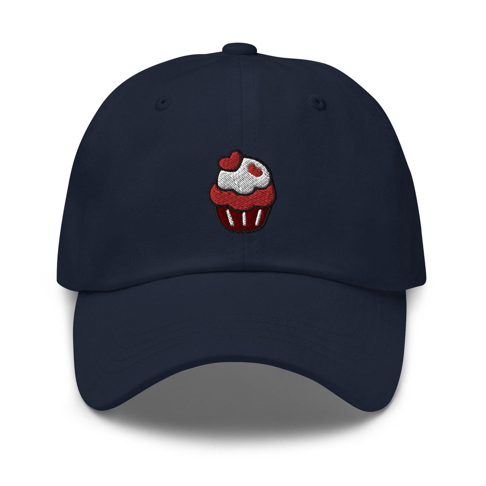 a blue hat with a cupcake embroidered on it