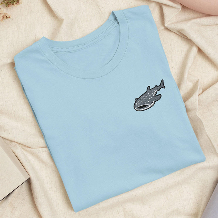 a blue t - shirt with a fish embroidered on it