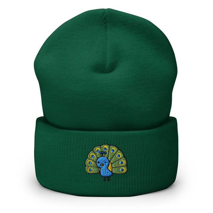 a green beanie with a blue peacock on it