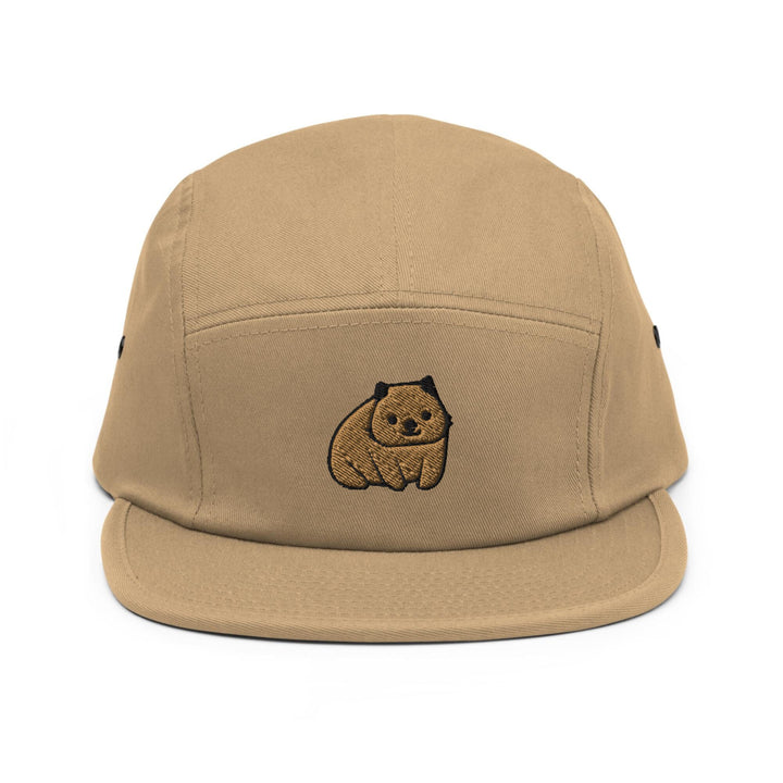 a tan hat with a brown bear embroidered on it