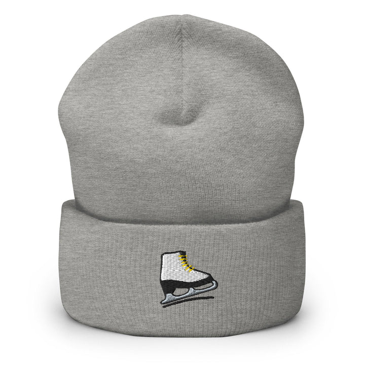a grey beanie with a pair of ice skates on it