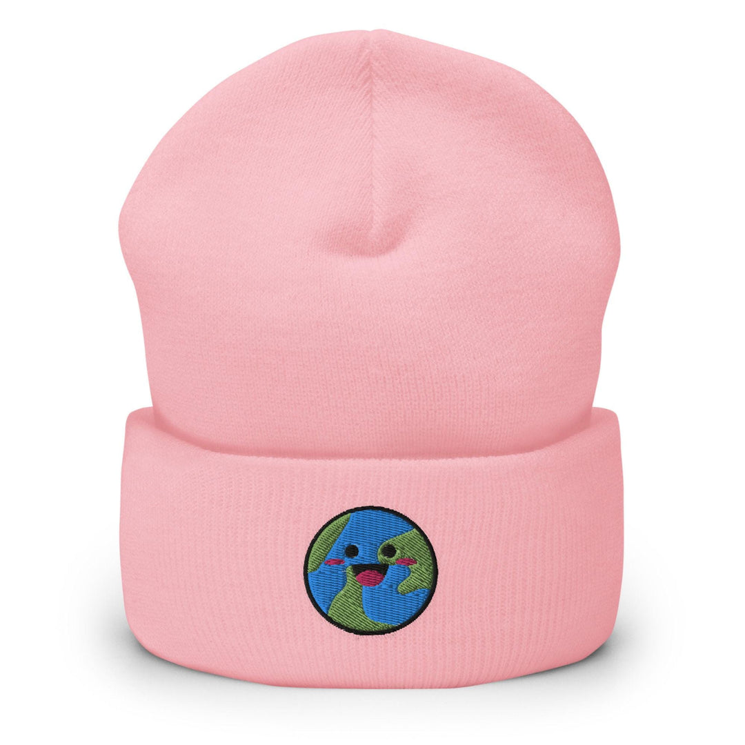 a pink beanie with a smiling face on it