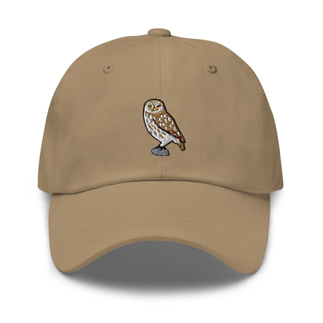 a tan hat with an owl embroidered on it