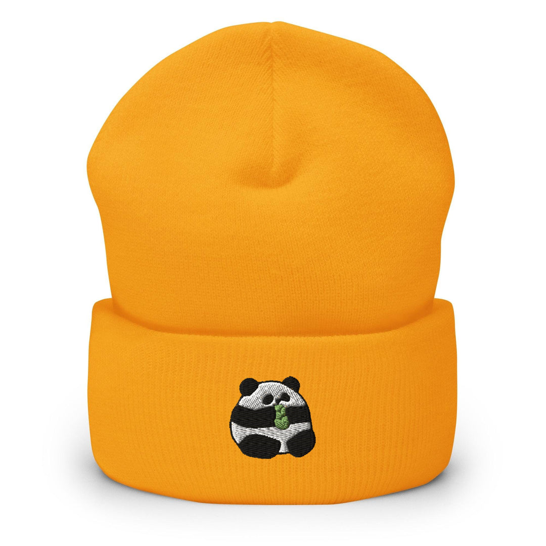 a yellow beanie with a panda bear on it