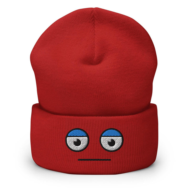 a red beanie with a face drawn on it