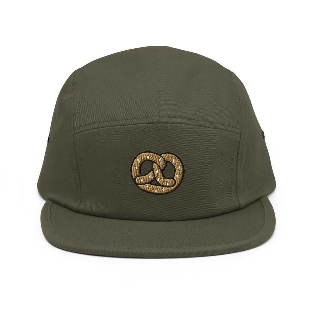 a green hat with a gold chain on it