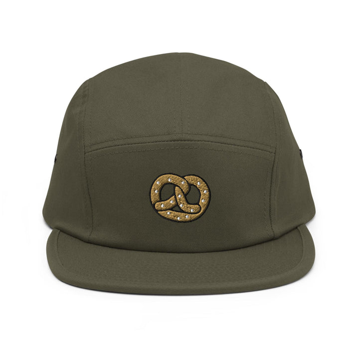 a green hat with a gold chain on it