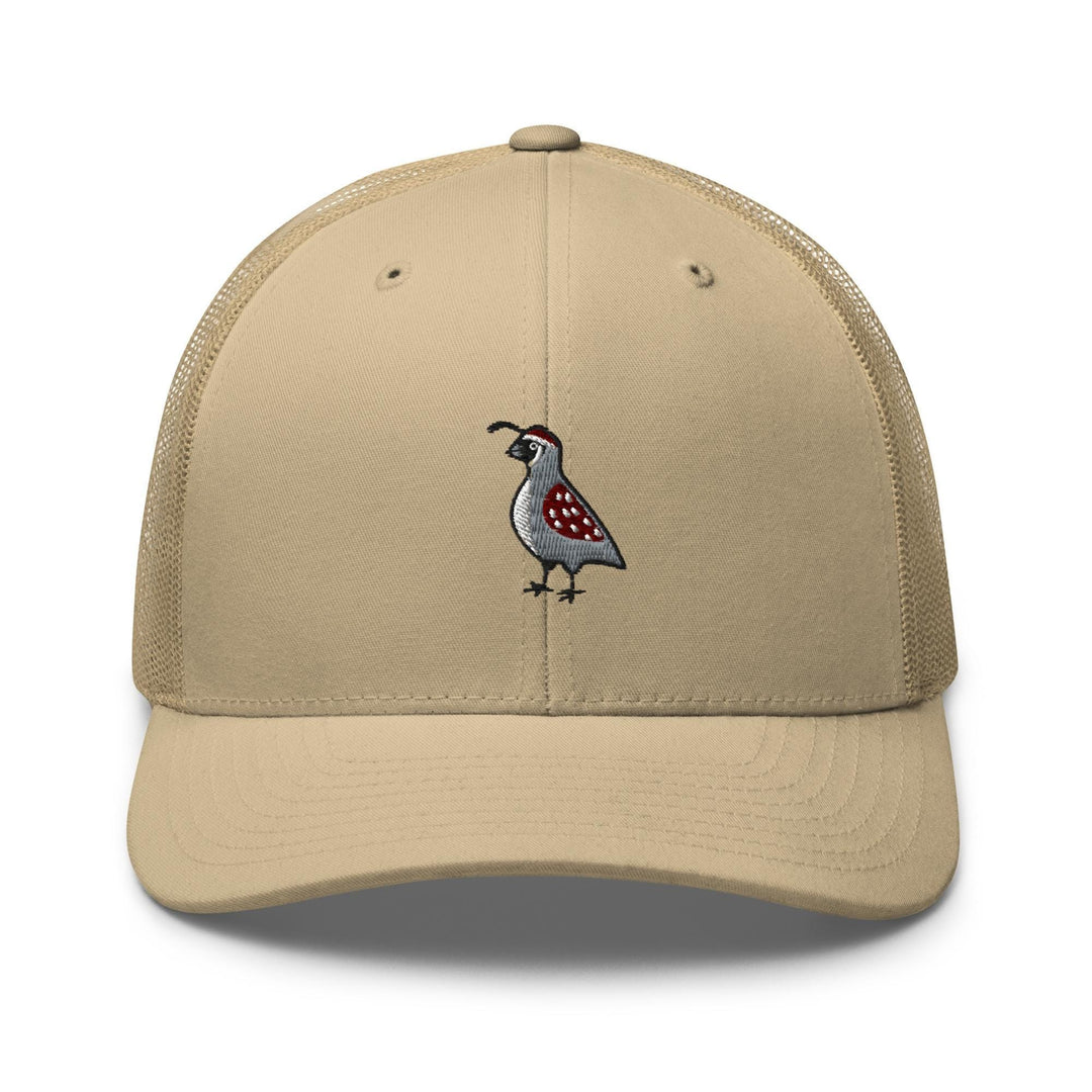 a tan hat with a bird embroidered on it