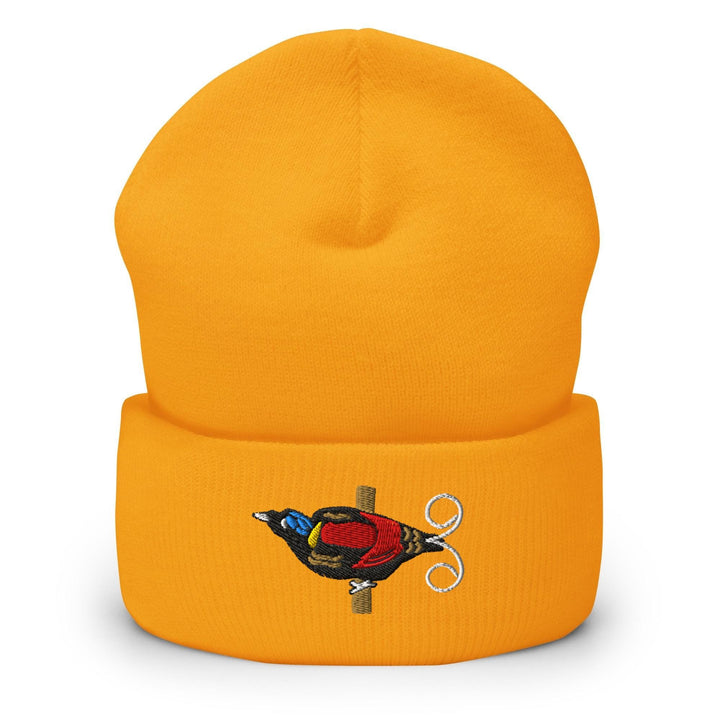 a yellow beanie with a bird on it