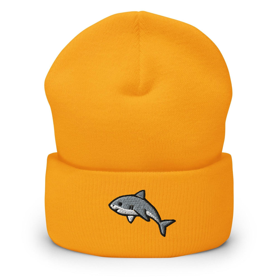 a yellow hat with a shark embroidered on it