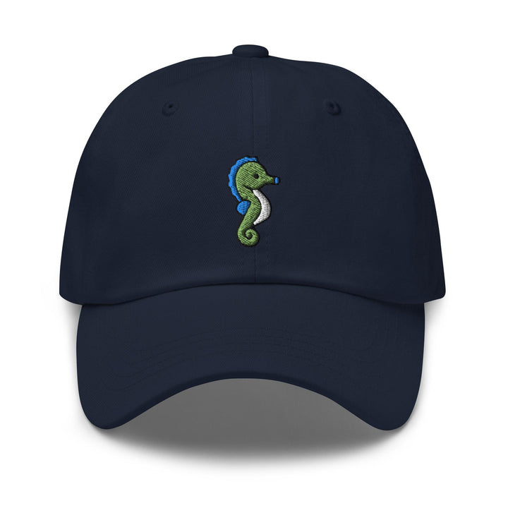 a blue hat with a green seahorse embroidered on it