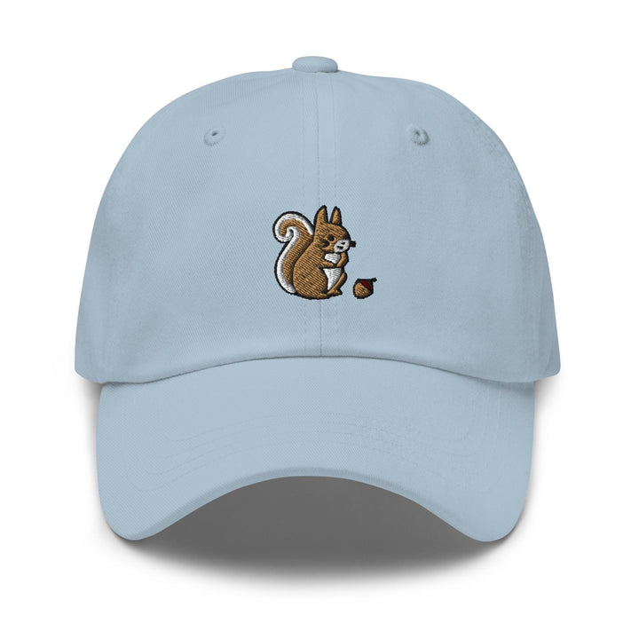 a light blue cap with a squirrel eating an acorn