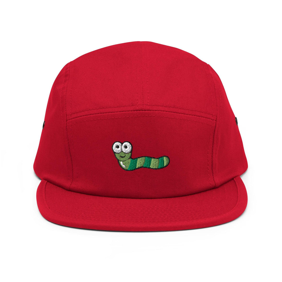 a red hat with a green caterpillar embroidered on it