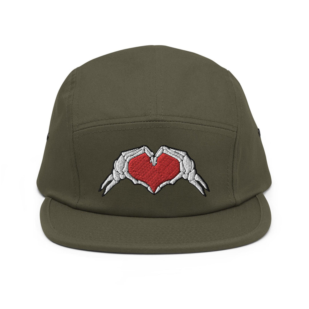 a green hat with two hands holding a red heart