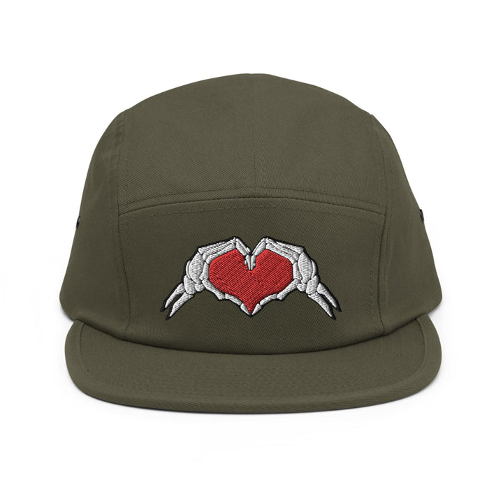 a green hat with two hands holding a red heart