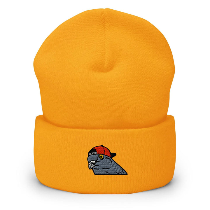 a yellow beanie with an image of a bird on it