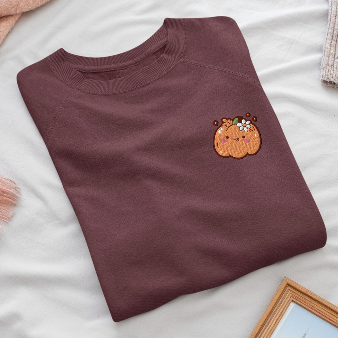 a t - shirt with a picture of a pumpkin on it