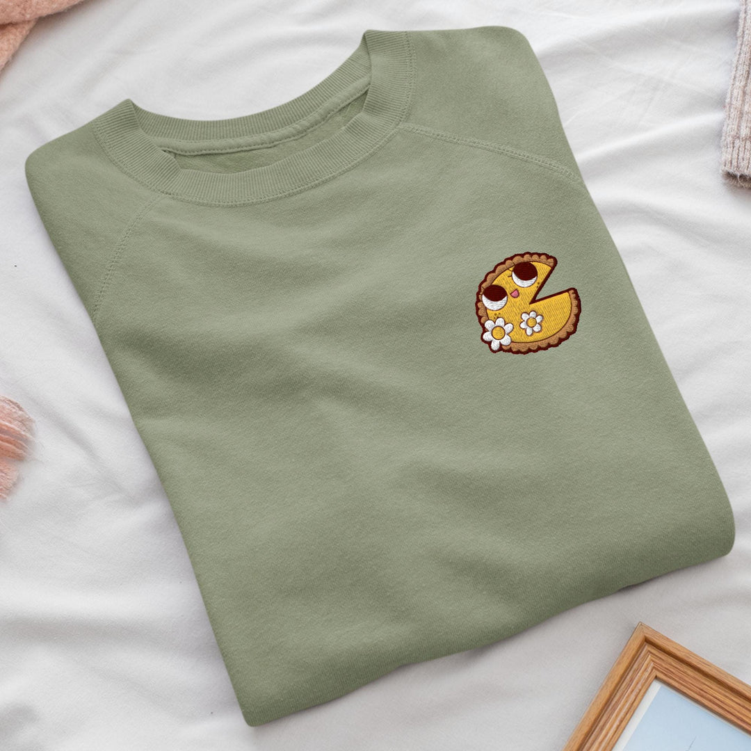 a green t - shirt with a picture of a donut on it