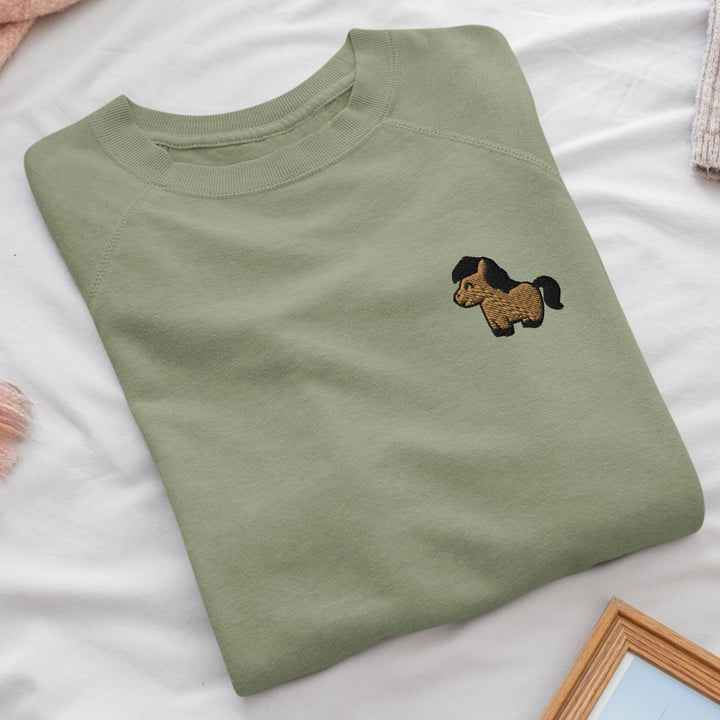 a t - shirt with a dog embroidered on it