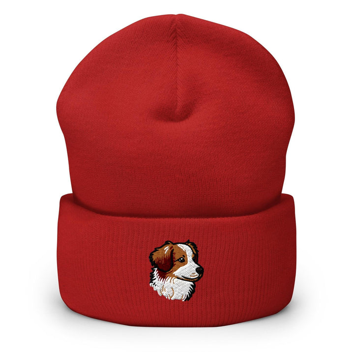a red beanie with a picture of a dog on it