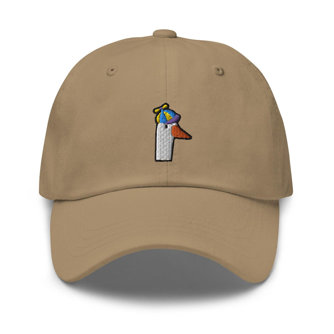 a tan hat with a bird on top of it