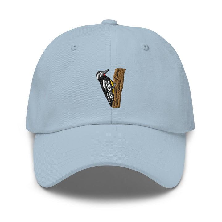 a light blue hat with a bird on it