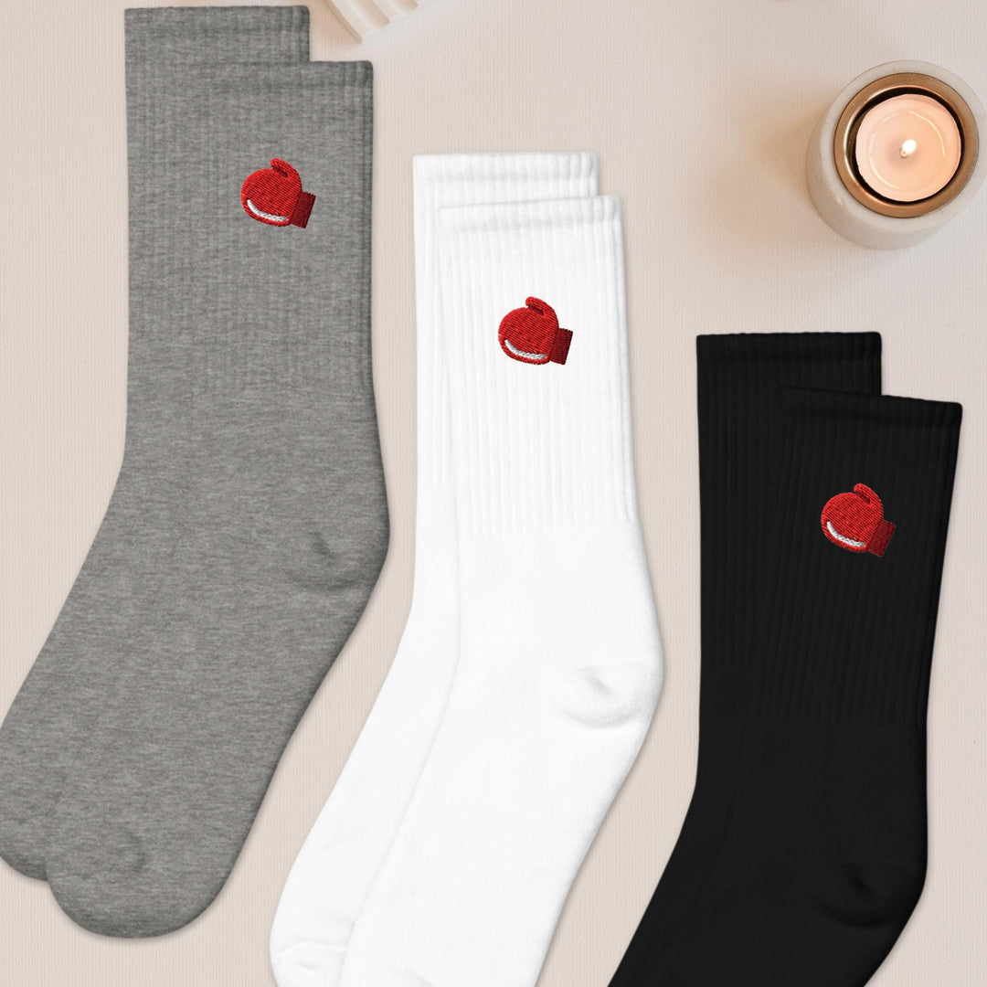 three pairs of socks with hearts on them