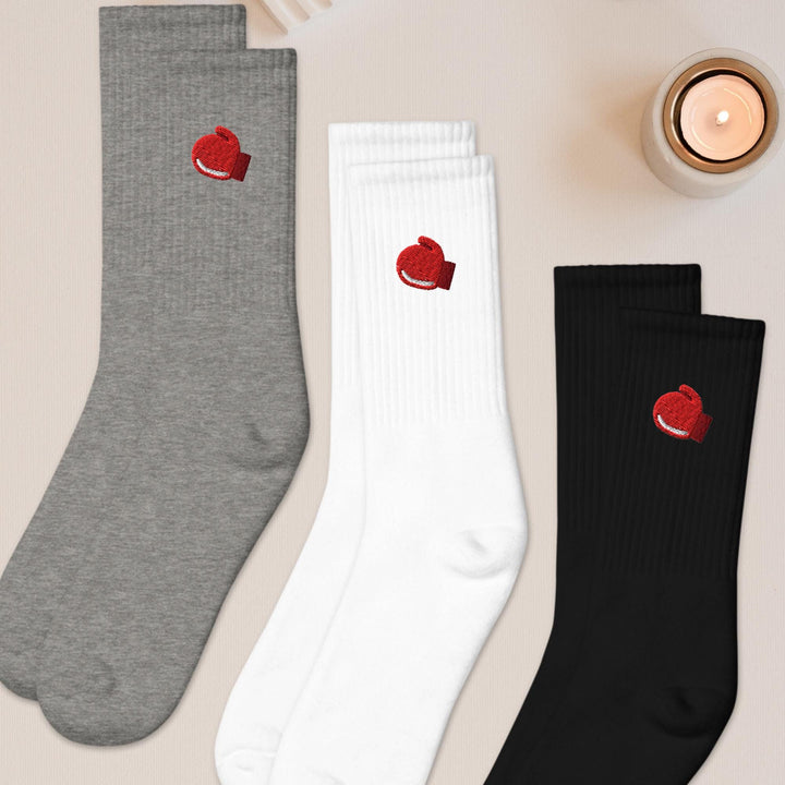 three pairs of socks with hearts on them