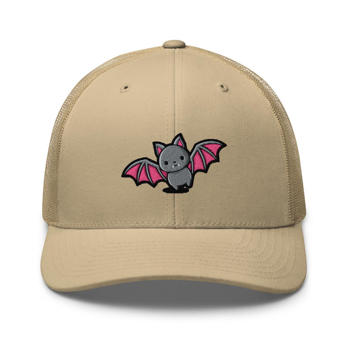 a tan trucker hat with a cartoon of a bat