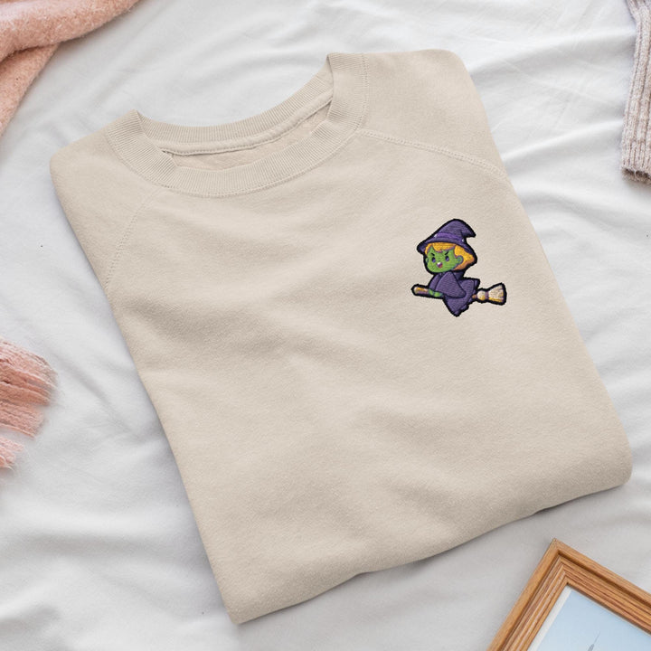 a t - shirt with a picture of a witch on it