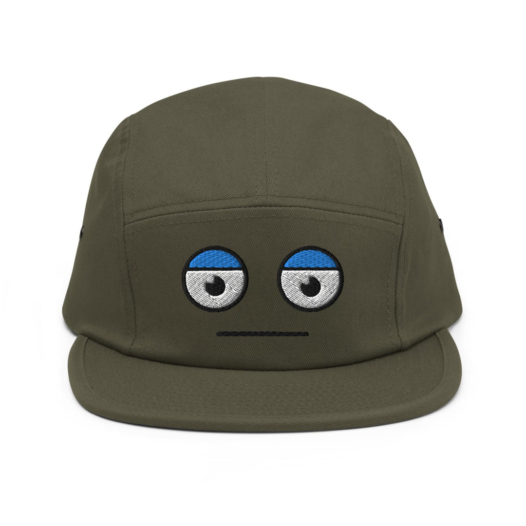 a green hat with eyes drawn on it